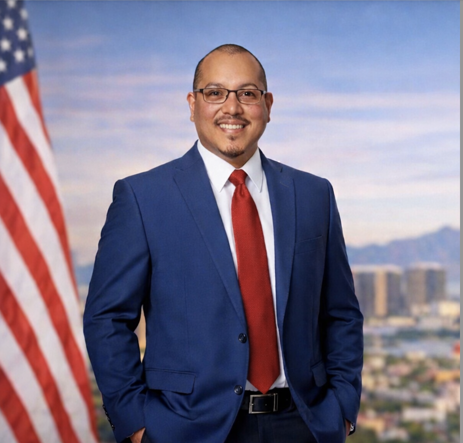 Edgar Velazquez with American flag with Las Vegas skyline in background