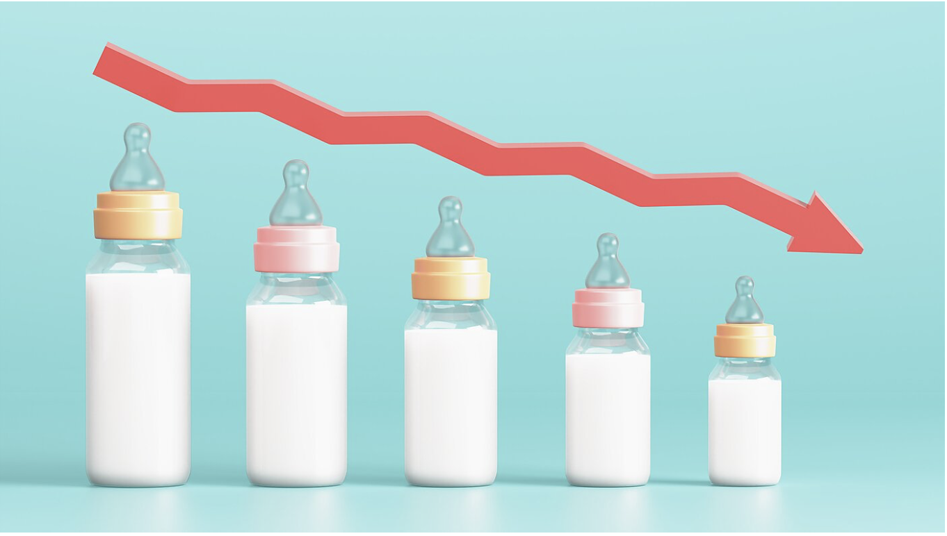 Symbolic image representing falling birth rates and declining fertility: baby bottles getting progressively smaller with a sharp red downward trend arrow