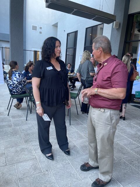 Don Salazar networking with woman